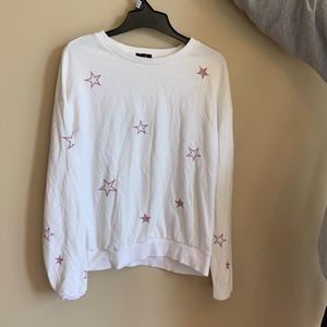 White sweater with pink shimmery stars
